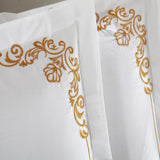 Egyptian Cotton Oriental Embroidery White with gold accent.